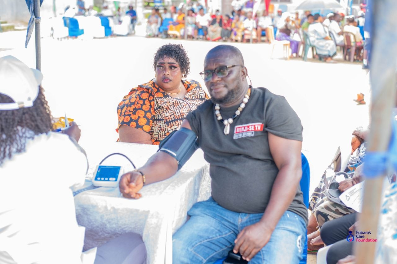 A community member having his blood pressure checked at the vitals station during the Free Medical Outreach