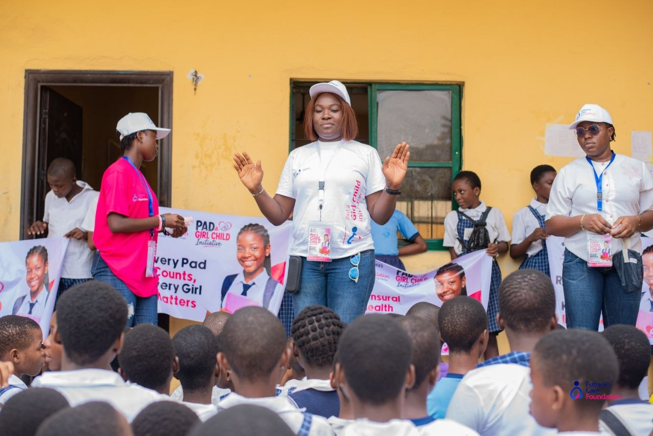 A Fubara's Care Foundation facilitator leading the Pad a Girl Child assembly at Elelenwo