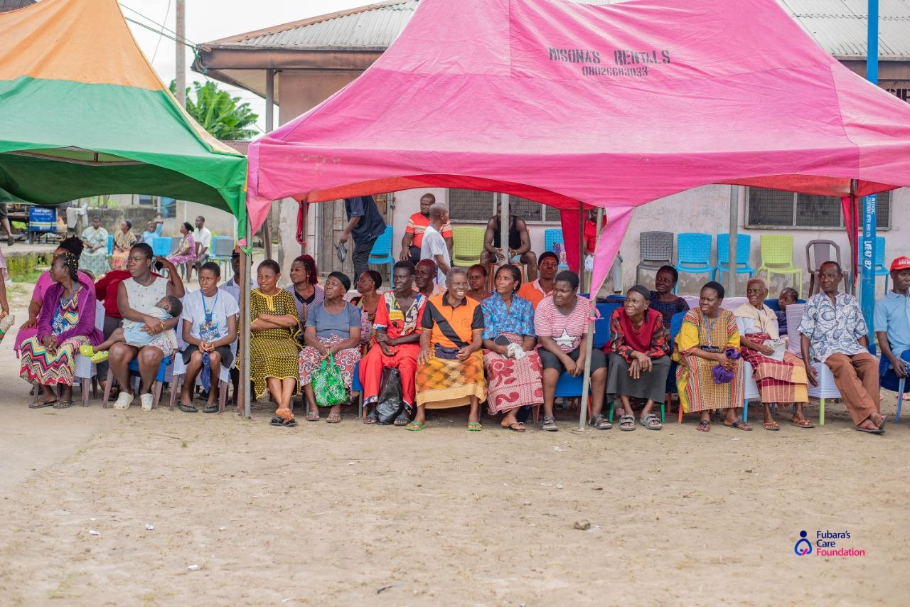 Mothers, elders and children gathered under the tents during the Free Medical Outreach in Bakana Community