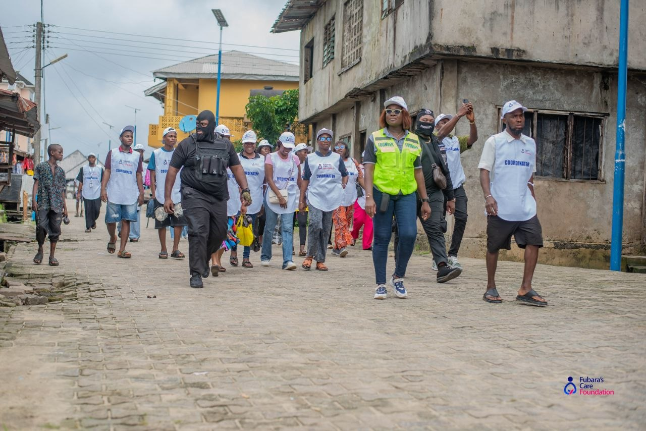 The Founder and the Fubara's Care Foundation team walking through Bakana Community towards Boma Mingi Suku, Will-Braide Central