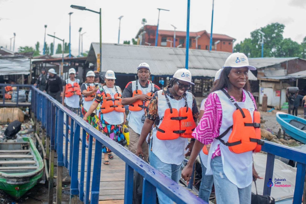The Fubara's Care Foundation team in life jackets crossing the Bakana jetty on the way to the Free Medical Outreach
