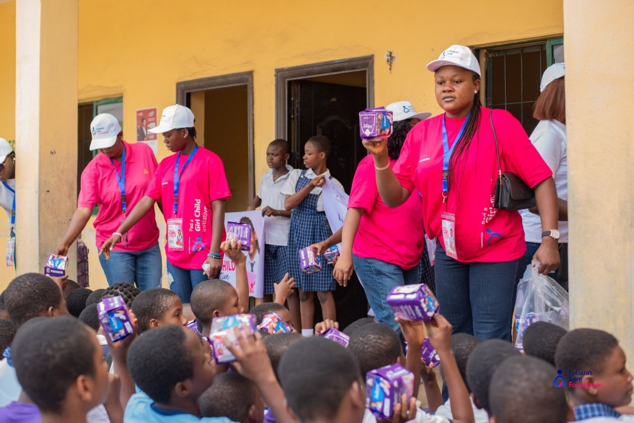 Volunteers distributing sanitary pads to students at Elelenwo, Obio-Akpor LGA